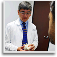 Dr. Howard Tung with a Patient